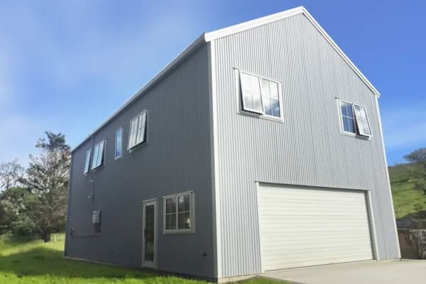 Architecturally designed two-storey home with integrated garaging, Auckland