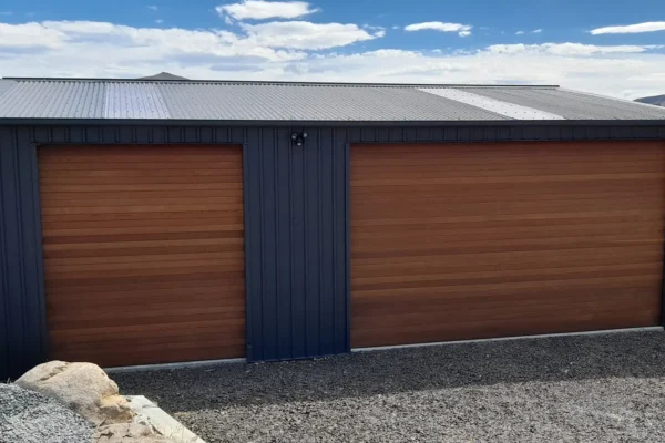 Single and double door garage with cedar doors